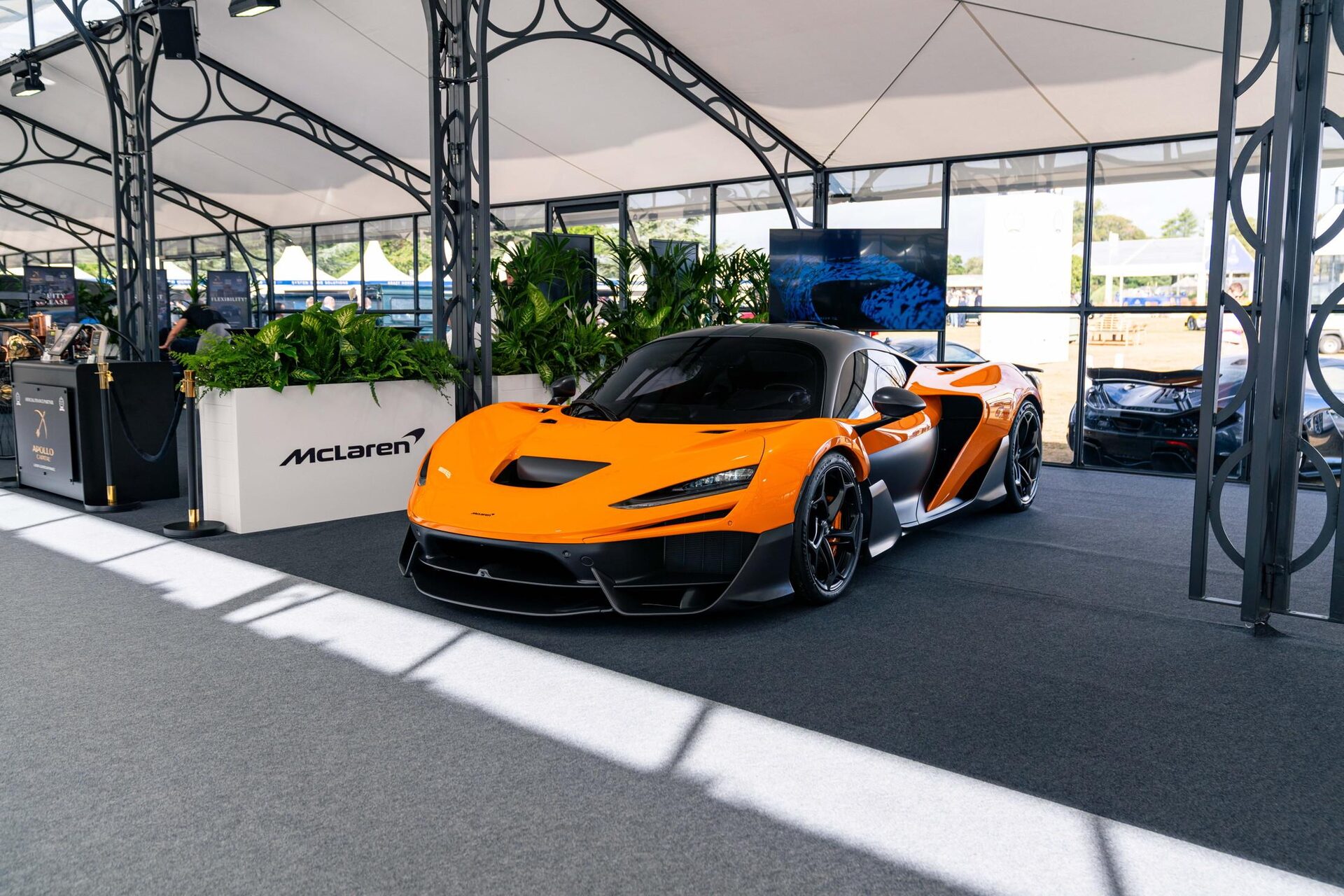 Modern hypercar on the lawn of a grand English estate
